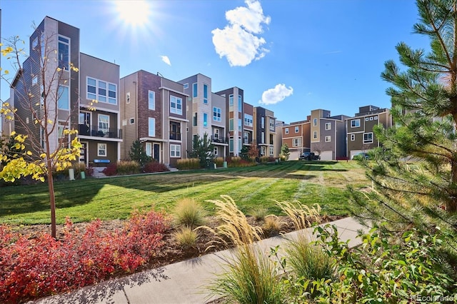 view of home's community featuring a lawn