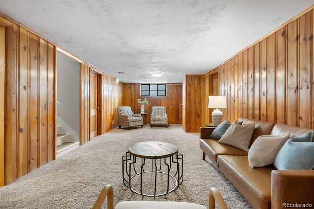 1295 Elm St, Denver, CO 80220 - living room featuring carpet flooring, wood walls, and stairs