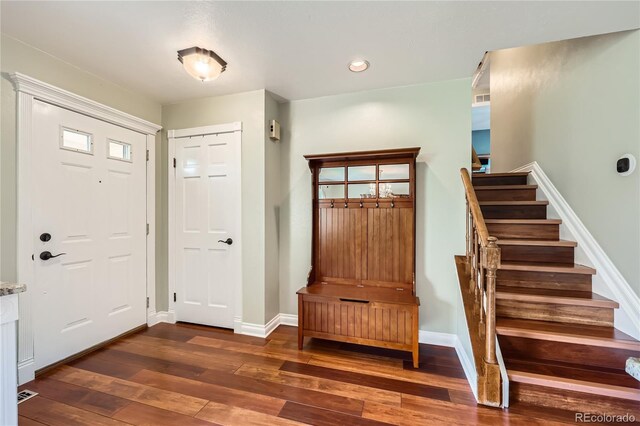 2023 S Rifle St, Aurora, CO 80013 - foyer entrance with dark wood-style flooring, stairway, baseboards, and recessed lighting