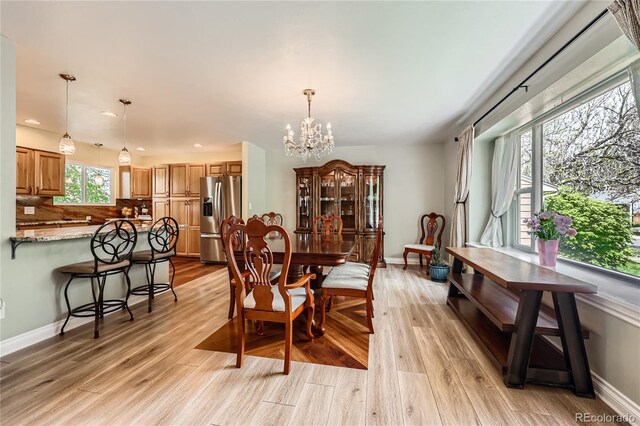 2023 S Rifle St, Aurora, CO 80013 - dining room featuring a chandelier, light wood-type flooring, baseboards, and recessed lighting