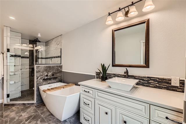 2023 S Rifle St, Aurora, CO 80013 - full bathroom featuring marble finish floors, walk in shower, a freestanding tub, and vanity