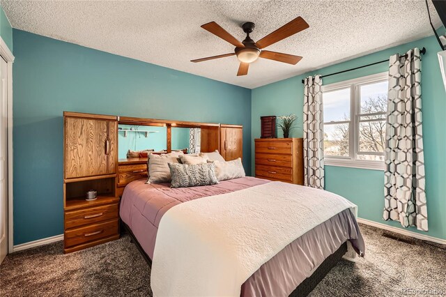 2023 S Rifle St, Aurora, CO 80013 - bedroom with dark carpet, baseboards, ceiling fan, and a textured ceiling