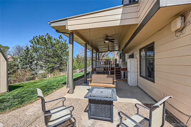 2023 S Rifle St, Aurora, CO 80013 - view of patio / terrace with a fire pit and a ceiling fan