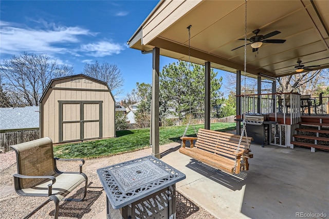 2023 S Rifle St, Aurora, CO 80013 - view of patio / terrace with a storage shed, a ceiling fan, and an outbuilding