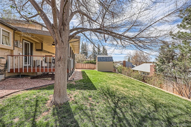 2023 S Rifle St, Aurora, CO 80013 - view of yard with a storage unit, an outbuilding, ceiling fan, and a wooden deck