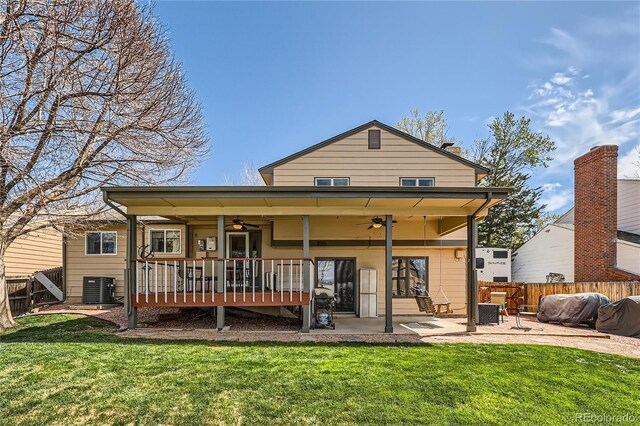 2023 S Rifle St, Aurora, CO 80013 - rear view of house featuring a ceiling fan, a patio area, central air condition unit, and a wooden deck