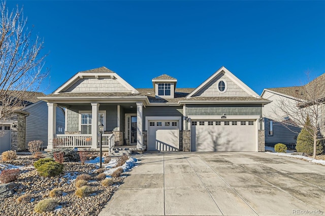 view of front of house with a garage and a porch