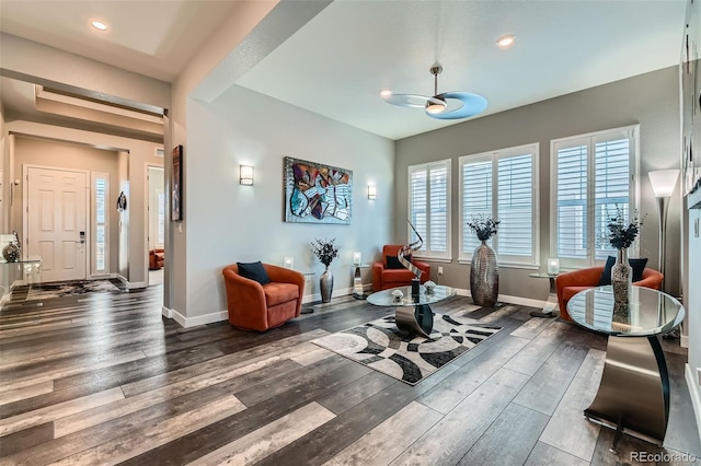 workout room with ceiling fan and dark hardwood / wood-style floors