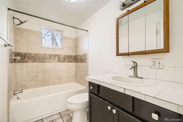 bathroom with bathtub / shower combination, tile patterned flooring, vanity, and toilet