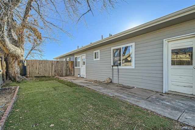 exterior space featuring fence and a patio