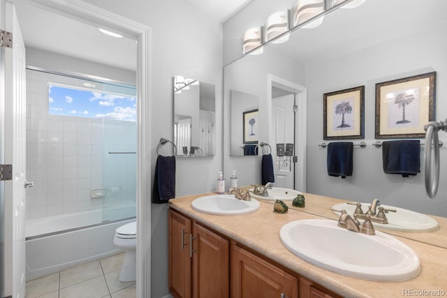 bathroom with tile patterned floors, toilet, double vanity, and combined bath / shower with glass door
