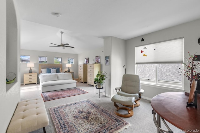 carpeted bedroom featuring baseboards, a ceiling fan, and vaulted ceiling