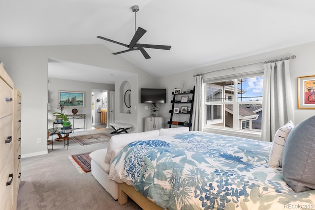 carpeted bedroom with lofted ceiling, baseboards, ceiling fan, and connected bathroom