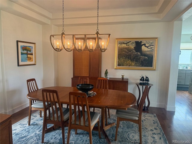 5319 W Hoover Dr, Littleton, CO 80123 - dining area with a chandelier, dark wood-style floors, and a raised ceiling