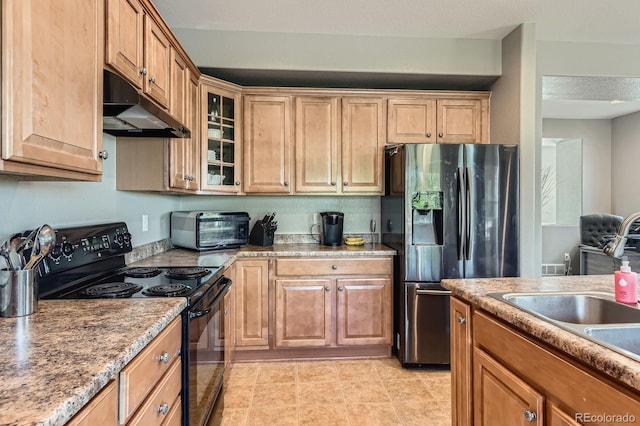 9424 Ridgeline Blvd, Highlands Ranch, CO 80129 - kitchen featuring black range with electric stovetop, under cabinet range hood, stainless steel fridge with ice dispenser, glass insert cabinets, and brown cabinets