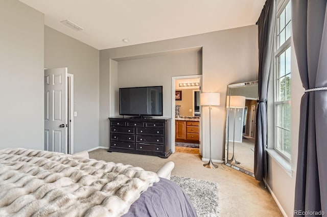 9424 Ridgeline Blvd, Highlands Ranch, CO 80129 - bedroom featuring light carpet, vaulted ceiling, and connected bathroom