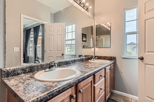 9424 Ridgeline Blvd, Highlands Ranch, CO 80129 - bathroom with double vanity, plenty of natural light, and tile patterned floors