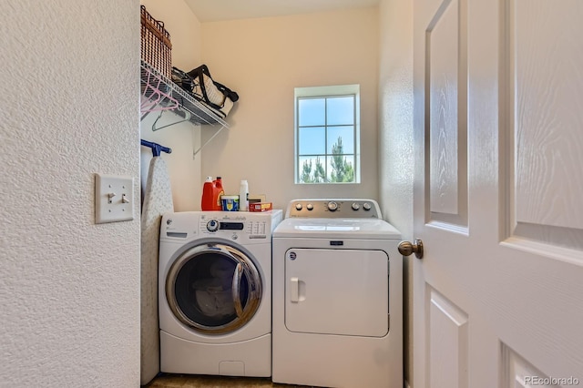 9424 Ridgeline Blvd, Highlands Ranch, CO 80129 - laundry room with separate washer and dryer and a textured wall
