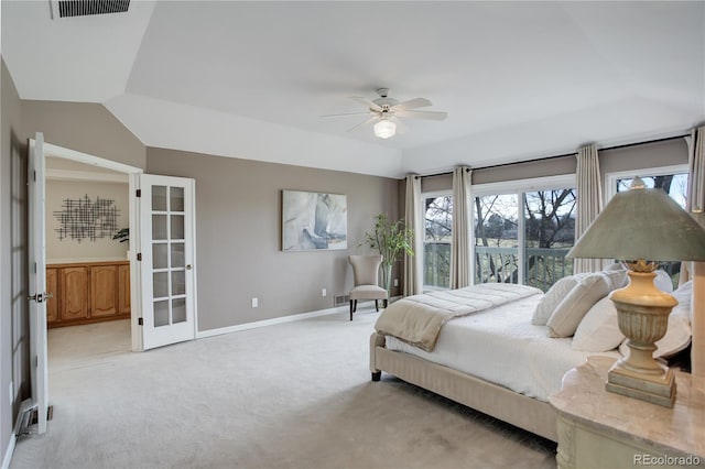 bedroom featuring vaulted ceiling, light colored carpet, french doors, and ceiling fan