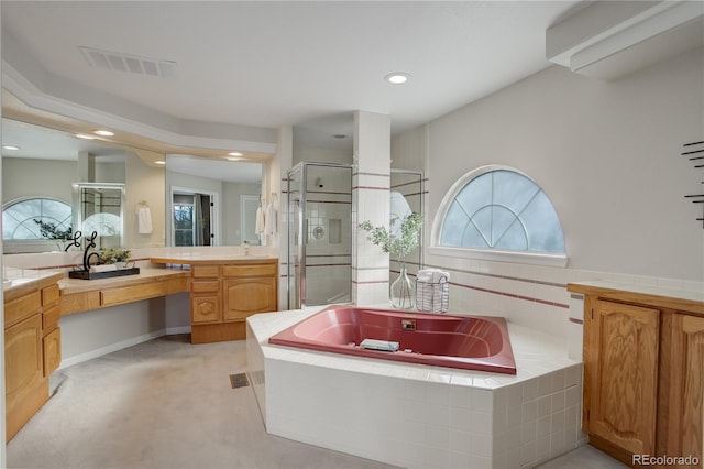 bathroom with vanity and separate shower and tub