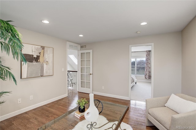 living room with hardwood / wood-style flooring and french doors