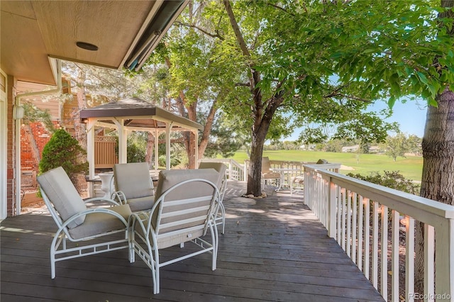 wooden deck featuring a gazebo