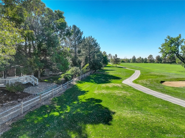 view of property's community featuring a lawn