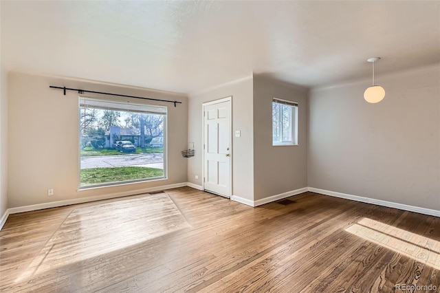 3075 Fairfax St, Denver, CO 80207 - entrance foyer featuring wood finished floors, visible vents, and baseboards