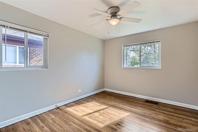 3075 Fairfax St, Denver, CO 80207 - empty room featuring visible vents, wood finished floors, baseboards, and a ceiling fan