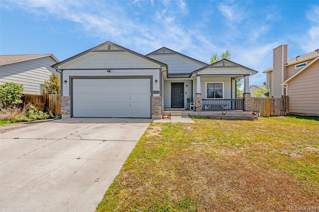 878 Candlestar Loop, Fountain, CO 80817 - craftsman-style home featuring a garage, concrete driveway, and a porch
