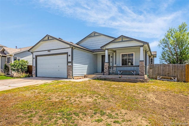878 Candlestar Loop, Fountain, CO 80817 - view of front facade featuring a porch, a garage, and concrete driveway