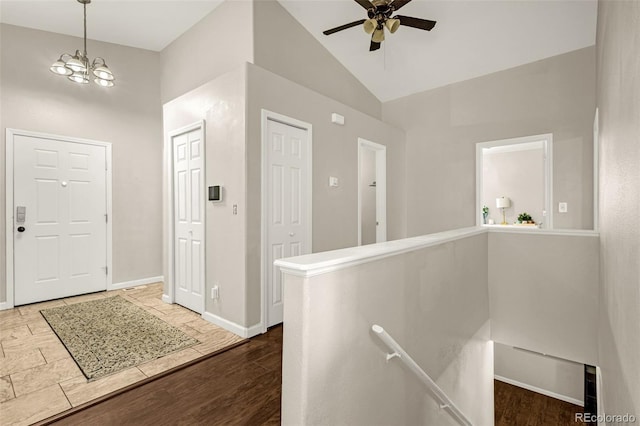 878 Candlestar Loop, Fountain, CO 80817 - foyer entrance with high vaulted ceiling, ceiling fan, a chandelier, baseboards, and wood finished floors