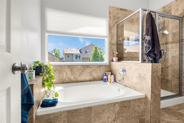 878 Candlestar Loop, Fountain, CO 80817 - bathroom featuring a bath and a shower stall