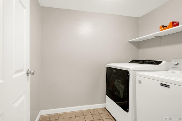 878 Candlestar Loop, Fountain, CO 80817 - laundry area featuring independent washer and dryer, baseboards, and light tile patterned floors