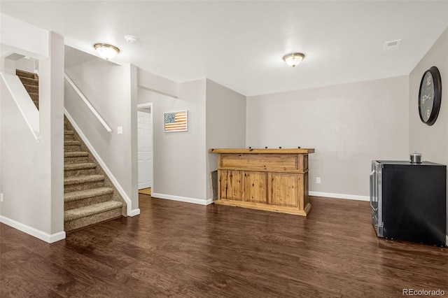 878 Candlestar Loop, Fountain, CO 80817 - living area with dark wood-style floors, stairs, and baseboards