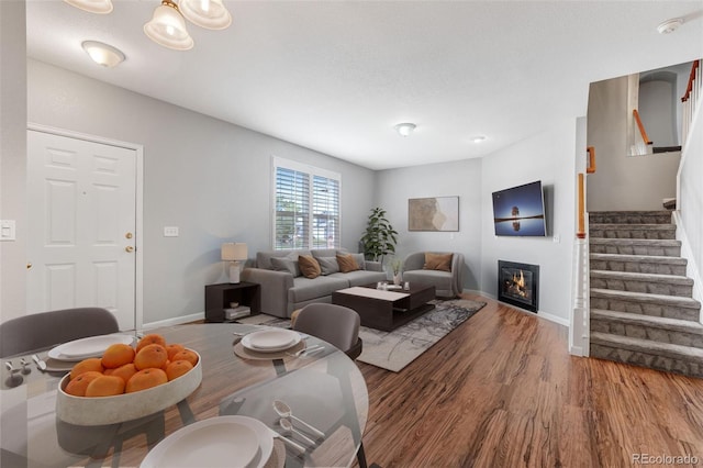 8237 W 54th Ave Unit 2, Arvada, CO 80002 - dining space with wood finished floors, stairway, and a glass covered fireplace