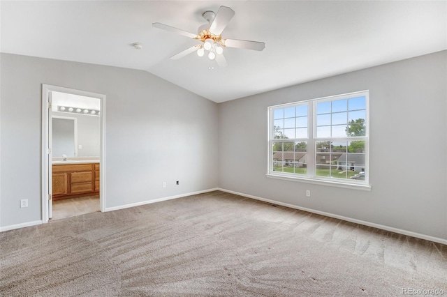 8237 W 54th Ave Unit 2, Arvada, CO 80002 - unfurnished bedroom with lofted ceiling, light carpet, ensuite bath, and a ceiling fan