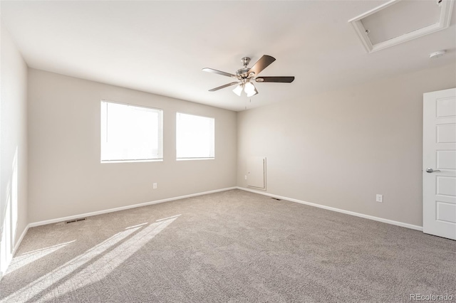 unfurnished room featuring visible vents, baseboards, a ceiling fan, and carpet flooring