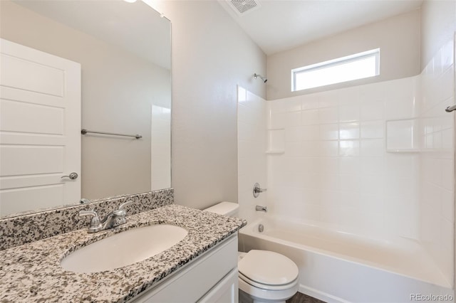 full bathroom featuring visible vents, vanity, toilet, and bathing tub / shower combination