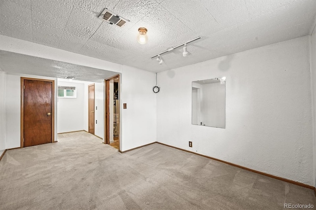 3306 S Logan St, Englewood, CO 80113 - empty room featuring track lighting and carpet