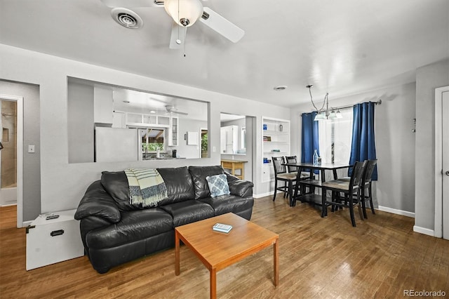 3306 S Logan St, Englewood, CO 80113 - living room with ceiling fan, wood finished floors, and plenty of natural light