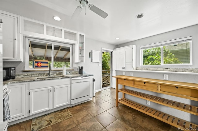 3306 S Logan St, Englewood, CO 80113 - kitchen featuring white dishwasher, white cabinets, light stone countertops, and recessed lighting