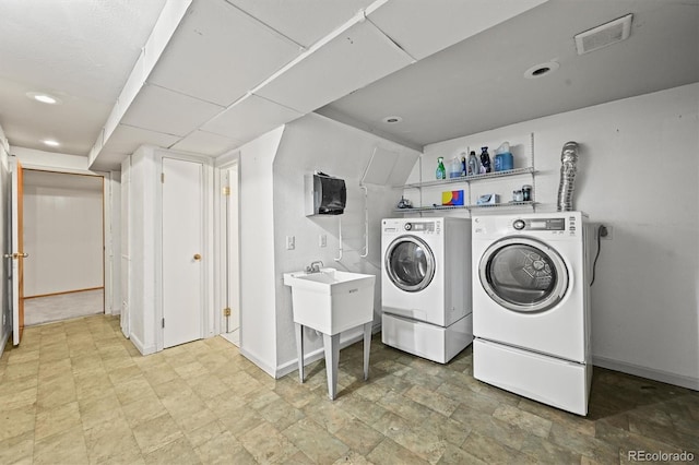 3306 S Logan St, Englewood, CO 80113 - laundry area featuring washer and clothes dryer and recessed lighting
