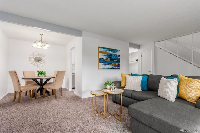 carpeted living room featuring beamed ceiling and a chandelier