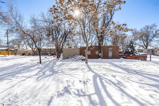 view of yard covered in snow