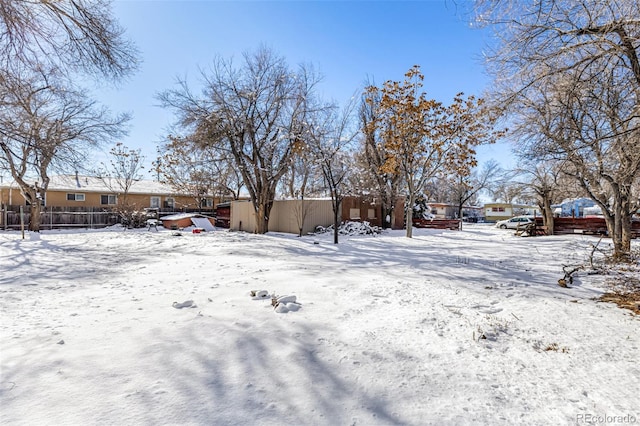 view of yard layered in snow