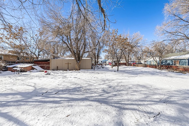 view of yard covered in snow