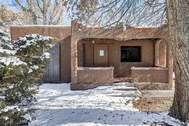 view of snow covered property