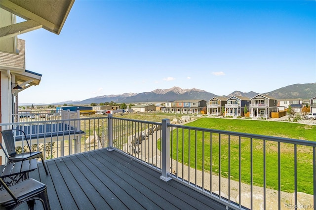 deck featuring a residential view and a mountain view