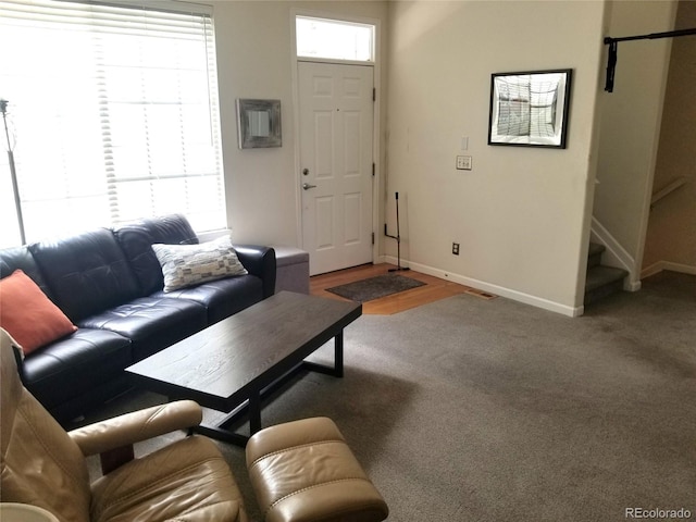 2240 S Pagosa Ct Unit B, Aurora, CO 80013 - carpeted living room featuring baseboards and stairs